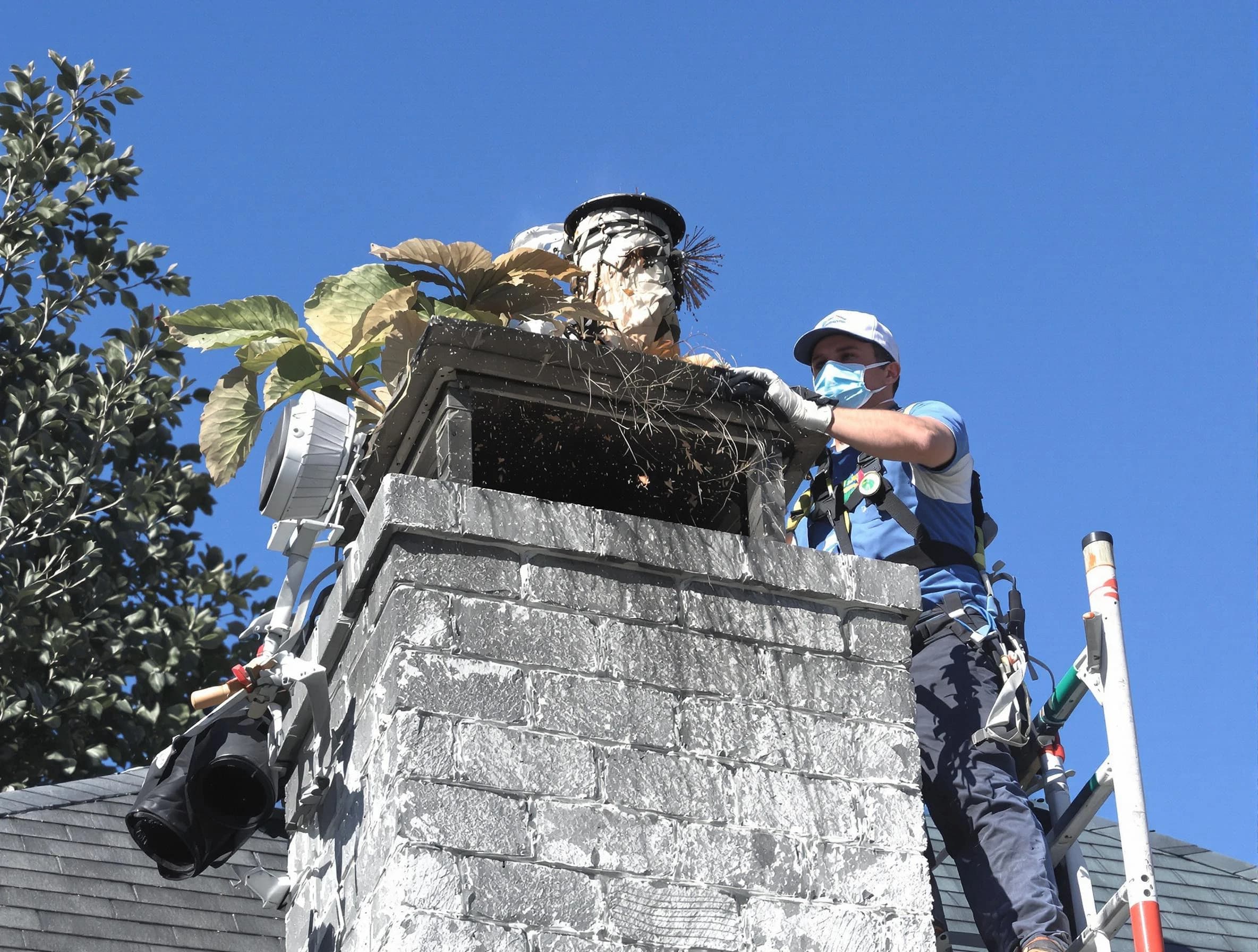 Scottsdale Chimney Sweep specialist performing chimney cleaning in Scottsdale, AZ